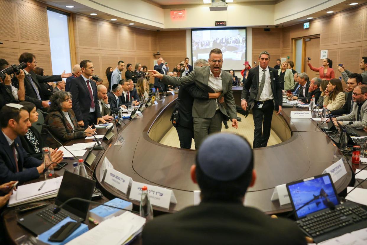 Opposition deputies protest as the first stage of controversial judicial reform is approved by the Knesset Law Committee on Feb. 13, 2023. <a href="https://www.gettyimages.com/detail/news-photo/opposition-deputies-protest-inside-the-knesset-during-a-news-photo/1247106087?phrase=knesset&adppopup=true" rel="nofollow noopener" target="_blank" data-ylk="slk:Photo by Israeli Parliament (Knesset) / Handout/Anadolu Agency via Getty Images;elm:context_link;itc:0;sec:content-canvas" class="link ">Photo by Israeli Parliament (Knesset) / Handout/Anadolu Agency via Getty Images</a>