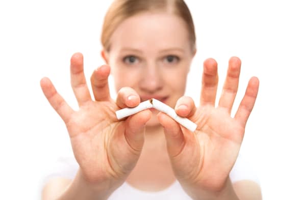 A woman breaking cigarette. concept stop smoking