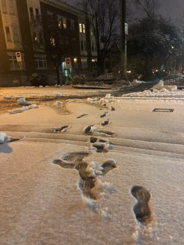 Footprints in the snow at 11th Avenue and Quebec Street in Vancouver early Feb. 25.