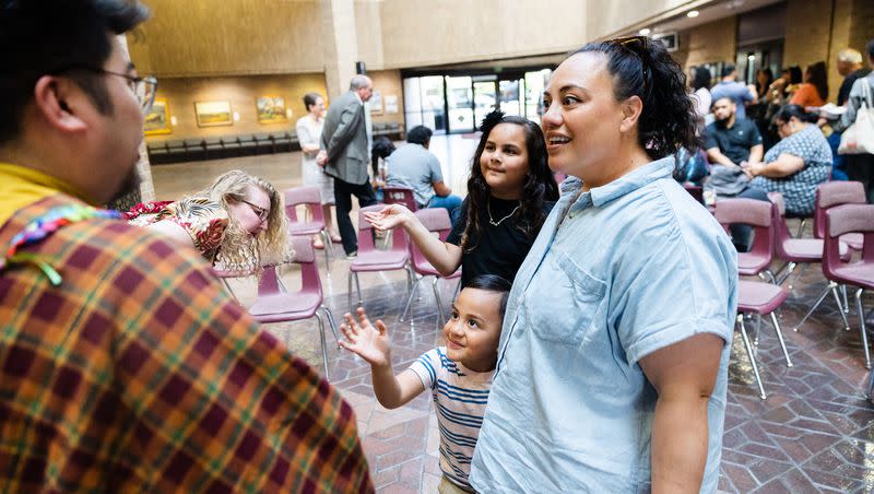 Jenilyn Su’a and her children Isikeli and Cora Satuala greet Emilio Manuel Came during the kick off of Asian-Pacific Islander Heritage month at the Salt Lake County Government Center in Salt Lake City on Monday.