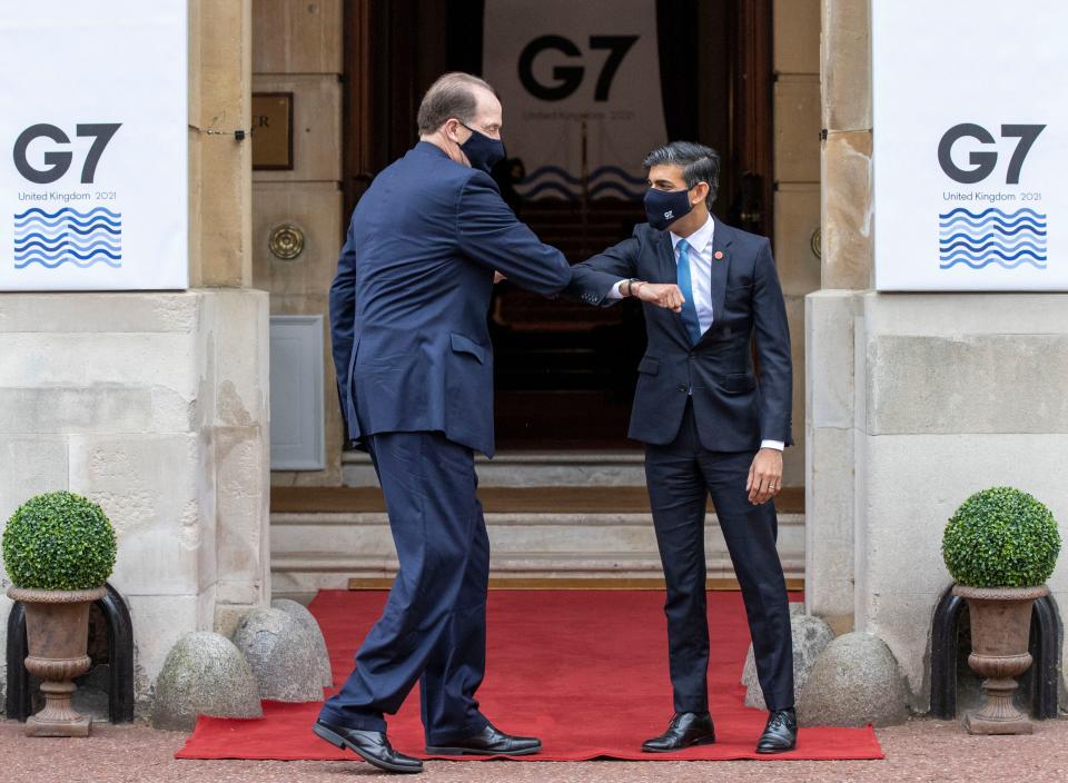 Britain's Chancellor of the Exchequer Rishi Sunak (R) welcomes President of the World Bank Group David Malpass to the G7 Finance Ministers Meeting at Lancaster House, central London on June 4, 2021. - Group of Seven (G7) finance chiefs gather this week to hammer out an agreement on corporate tax harmonisation aimed at raising revenues as economies recover from the coronavirus pandemic. (Photo by Steve REIGATE / POOL / AFP) (Photo by STEVE REIGATE/POOL/AFP via Getty Images)