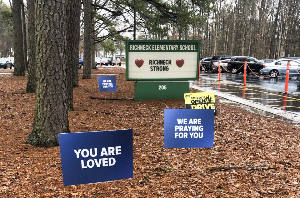 FILE - Signs stand outside Richneck Elementary School in Newport News, Va., Jan. 25, 2023. A former assistant principal at a Virginia elementary school has been indicted on eight felony counts of child neglect in the case of a 6-year-old boy who shot and wounded his first-grade teacher in Newport News, Virginia, last year, according to indictments unsealed Tuesday, April 9, 2024, in Newport News Circuit Court. (AP Photo/Denise Lavoie, File)