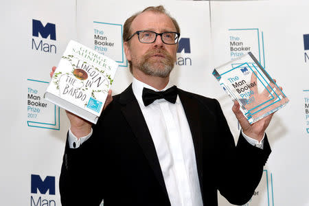 George Saunders, author of 'Lincoln in the Bardo', poses for photographers after winning the Man Booker Prize for Fiction 2017 in London, Britain, October 17, 2017. REUTERS/Mary Turner