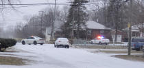 Indianapolis Metropolitan Police Department work the scene Sunday, Jan. 24, 2021 in Indianapolis where five people, including a pregnant woman, were shot to death early Sunday inside an Indianapolis home. Th pregnant woman who was taken to an area hospital, both she and the unborn child died despite life-saving efforts. (Justin L. Mack/The Indianapolis Star via AP)