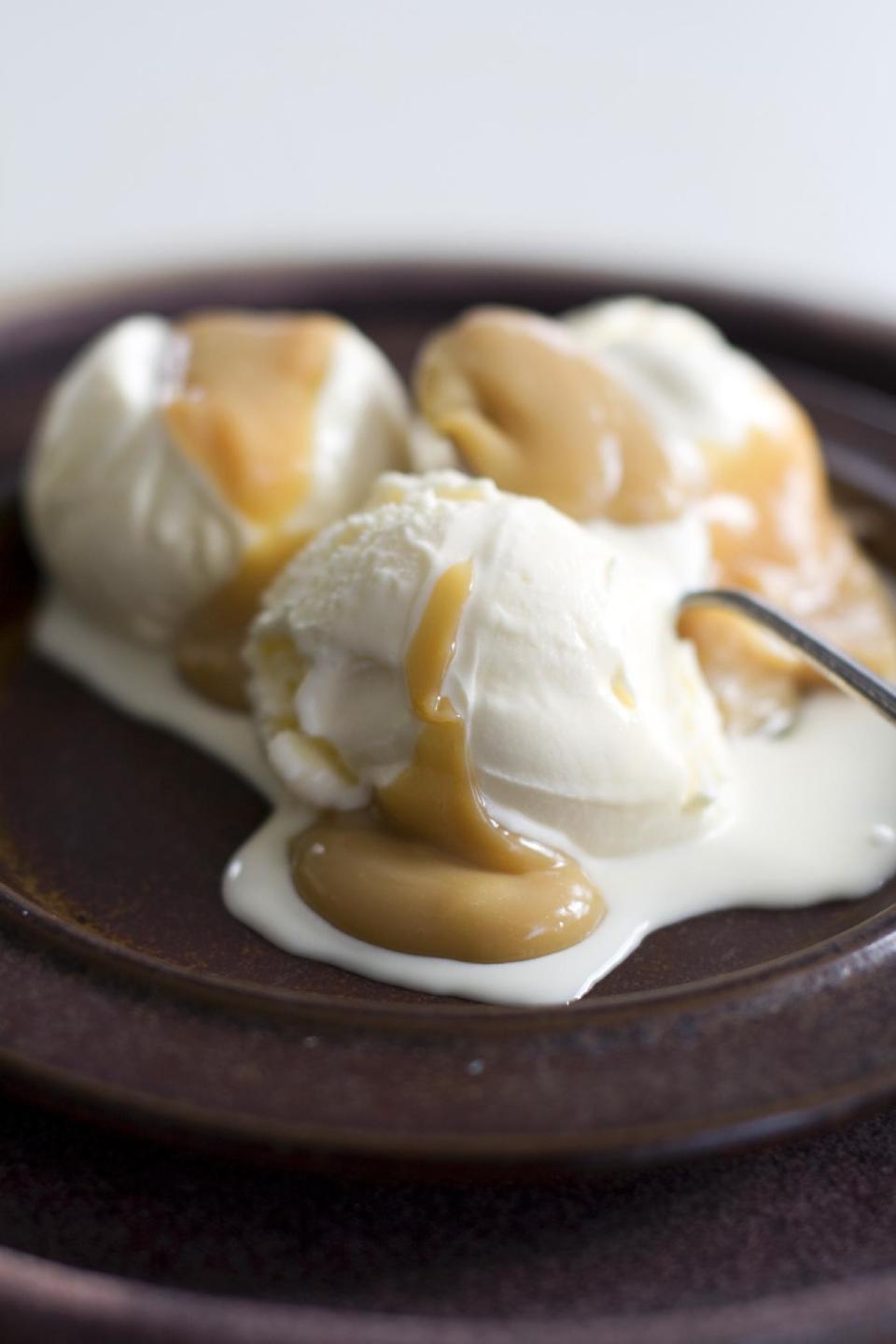 This April 1, 2013 photo taken in Concord, N.H. shows ice cream topped with a dulce de leche sauce. (AP Photo/Matthew Mead)