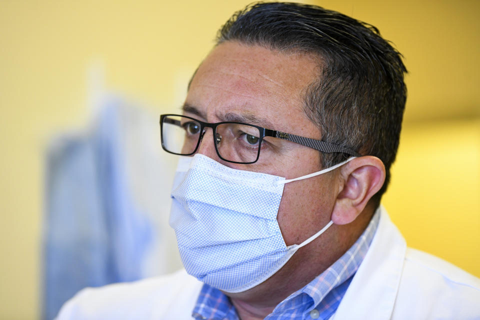 Dr. Ricardo Maldonado, who leads the pandemic response team at East Alabama Medical Center, says that he will spend his Christmas Day working in the COVID-19 unit Thursday, Dec. 10, 2020, in Opelika, Ala. (AP Photo/Julie Bennett)