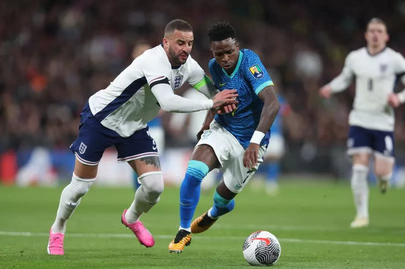 Kyle Walker competes with Vinicius Junior during England's clash with Brazil last month.