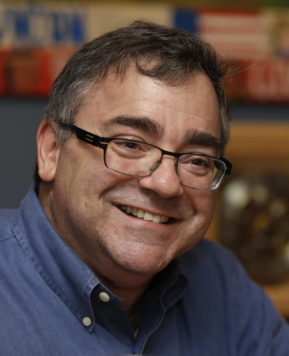 In this photo taken Thursday, Jan. 9, 2014, Spirit Airlines CEO Ben Baldanza smiles as he talks to a reporter at his home, in Fort Lauderdale, Fla. (AP Photo/Alan Diaz)