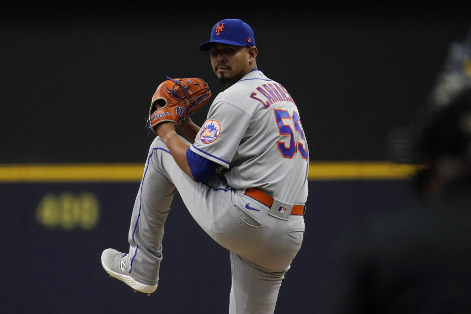 New York Mets' Carlos Carrasco pitches during the first inning of a baseball game against the Milwaukee Brewers Monday, April 3, 2023, in Milwaukee. (AP Photo/Aaron Gash)