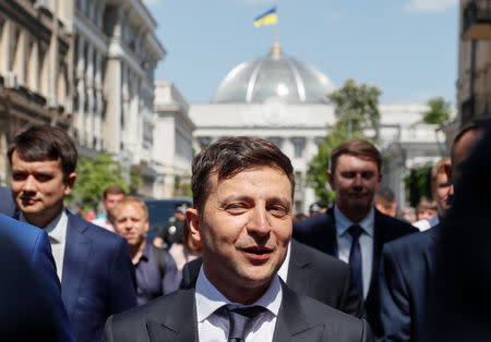 FILE PHOTO: Ukraine's President Volodymyr Zelenskiy walks from the parliament to the presidential administration office after his inauguration in Kiev, Ukraine May 20, 2019. REUTERS/Valentyn Ogirenko/File Photo