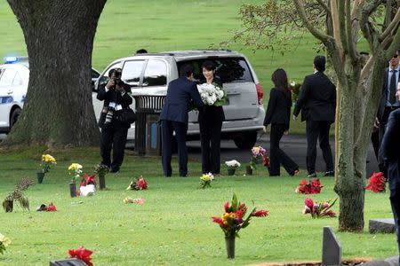 Japanese Prime Minister Shinzo Abe presents a wreath at the grave of U.S. Senator Daniel Inouye at the National Memorial Cemetery of the Pacific at Punchbowl in Honolulu, Hawaii, U.S. December26, 2016. REUTERS/Hugh Gentry