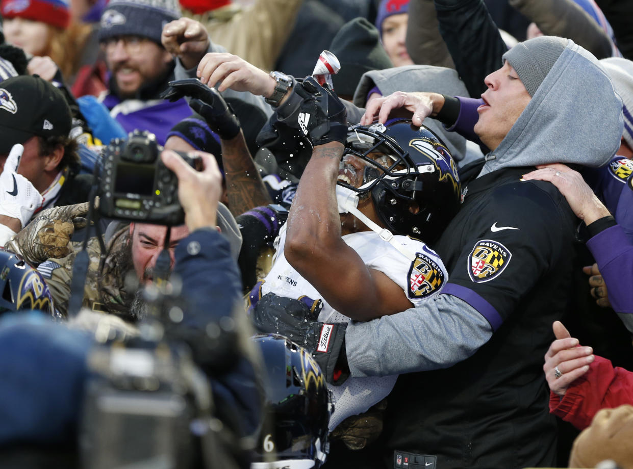 ORCHARD PARK, NY - DECEMBER 8:  Marcus Peters #24 of the Baltimore Ravens jumps in the crowd to celebrate breaking up a pass during the fourth quarter against the Buffalo Bills at New Era Field on December 8, 2019 in Orchard Park, New York.  Baltimore beats Buffalo 24 to 17. (Photo by Timothy T Ludwig/Getty Images)