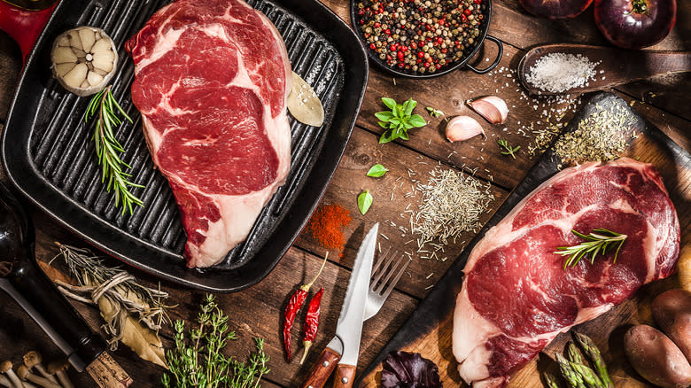 Raw steak being prepped