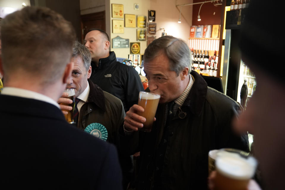 Brexit Party leader Nigel Farage sips a pint with the locals in a pub in Hull, East Yorkshire.