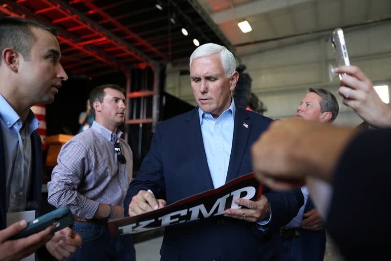 Former U.S. Vice President Mike Pence and Georgia Governor Brian Kemp attend a rally ahead of the state's Republican primary in Kennesaw