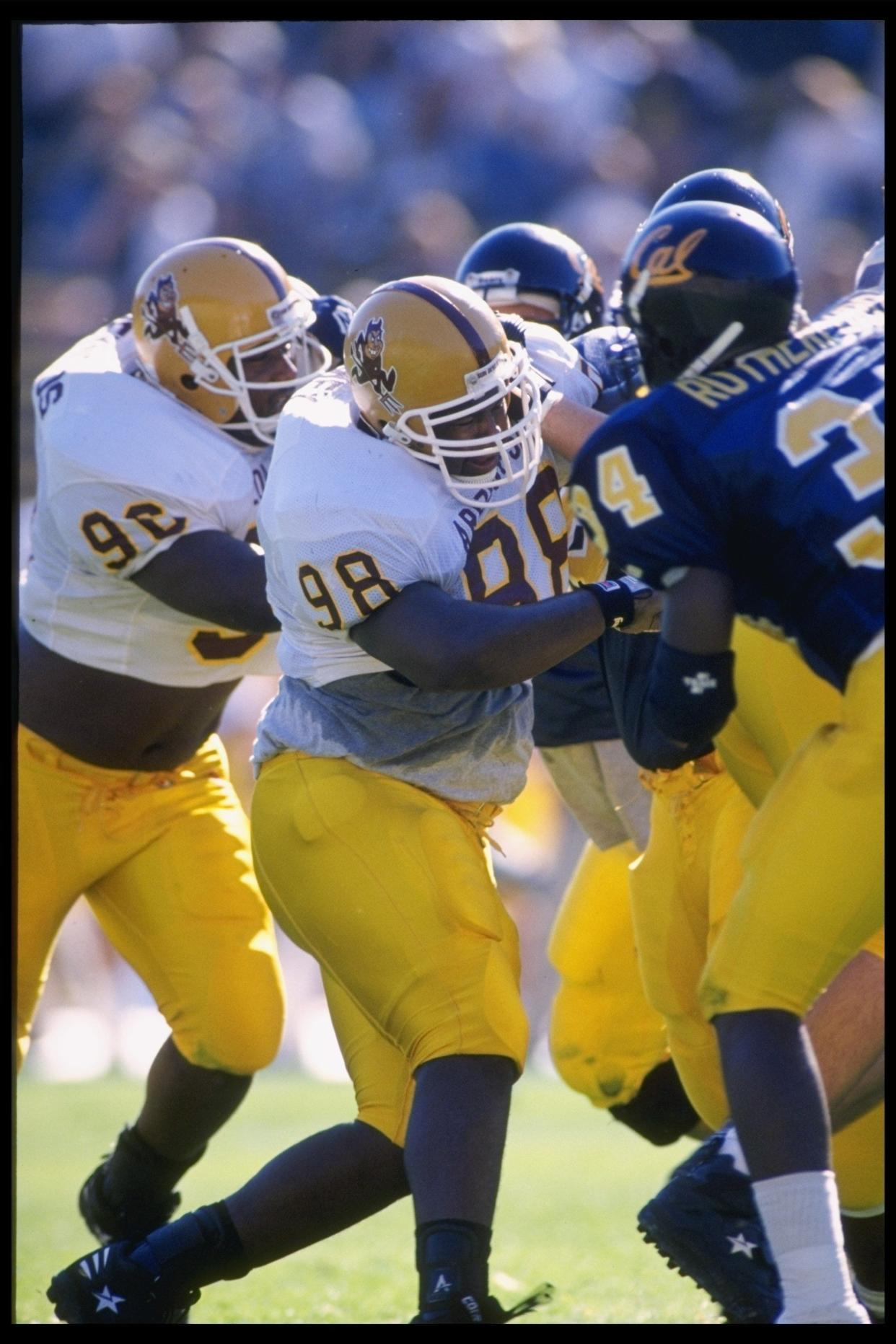 Defensive end Vince Amey (98) of the Arizona State Sun Devils makes a tackle during a game against the California Golden Bears at Memorial Stadium in Berkeley, California.  Arizona State won the game 38-29.