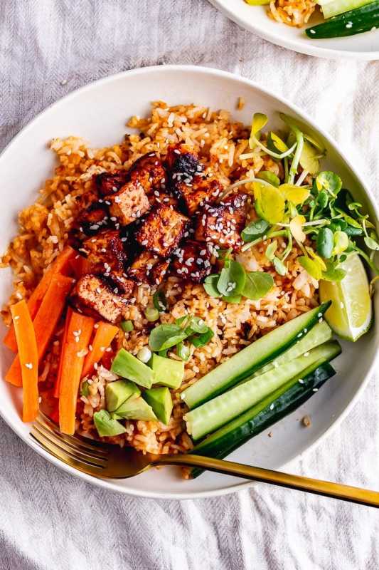 <p>The Cook Report</p><p>These spicy rice bowls are an explosion of flavor thanks to the Korean-style marinated tofu. Add your favorite toppings and a squeeze of hot sauce for an easy and healthy dinner.</p><p><strong>Get the recipe: <a href="https://thecookreport.co.uk/spicy-rice-bowls-korean-marinated-tofu/" rel="nofollow noopener" target="_blank" data-ylk="slk:Spicy Rice Bowls with Marinated Tofu;elm:context_link;itc:0;sec:content-canvas" class="link rapid-noclick-resp">Spicy Rice Bowls with Marinated Tofu</a></strong></p>