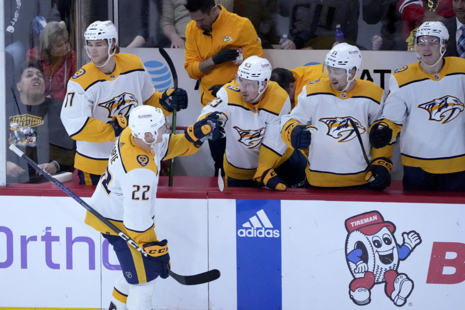 Nashville Predators' Tyson Barrie (22) celebrates teammates after his goal during the second period of an NHL hockey game against the Chicago Blackhawks, Saturday, March 4, 2023, in Chicago. (AP Photo/Charles Rex Arbogast)