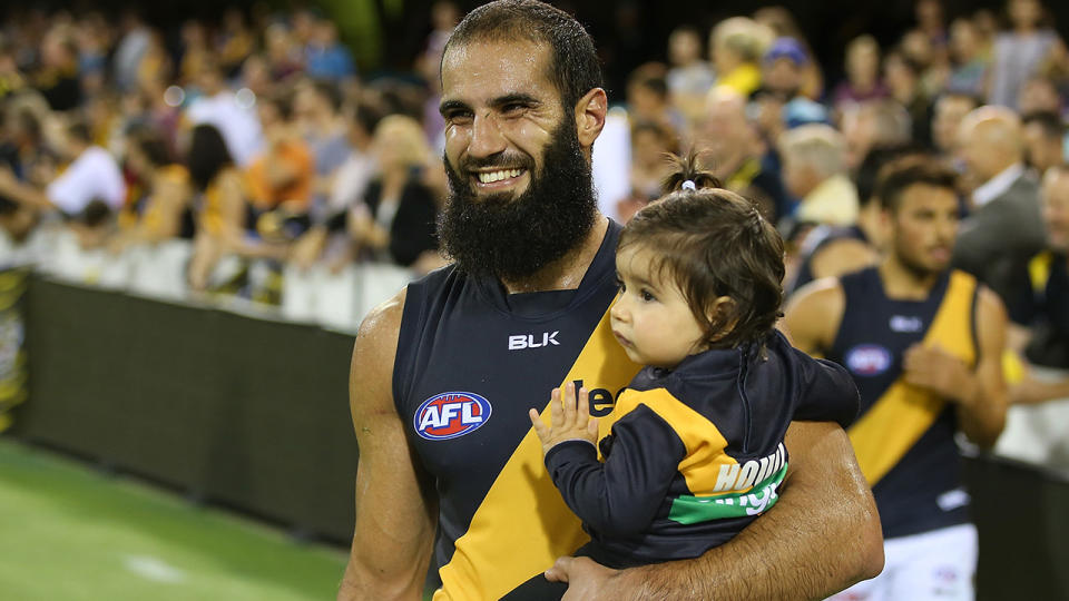 Bachar Houli, pictured here with his daughter before a Richmond game.