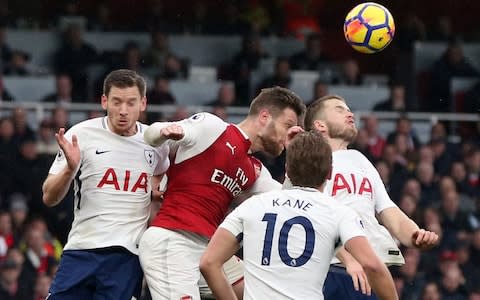 Arsenal's Shkodran Mustafi (centre) scores his side's first goal  - Credit: PA