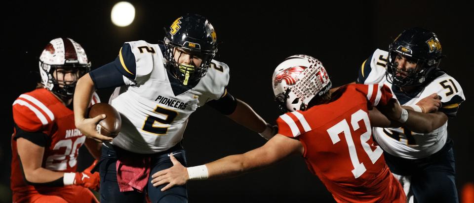 Mooresville Pioneers Hogan Denny (2) on the carry during the IHSAA Class 4A Regional Championship game between Mooresville Pioneers and New Palestine Dragons Friday, Nov. 10, 2023, at New Palestine High School in New Palestine. Dragons defeated Pioneers 39-6.