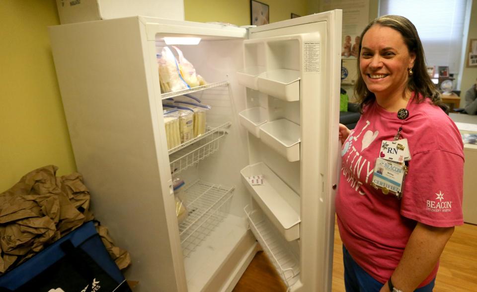 Mellisa Lathion, nurse educator and lactation coordinator for Memorial Hospital, stands by the refrigerator that serves as the breastmilk bank depot Tuesday, Feb. 14, 2023, at The Milk Bank's Memorial Hospital donor milk depot and donor milk express site in South Bend.