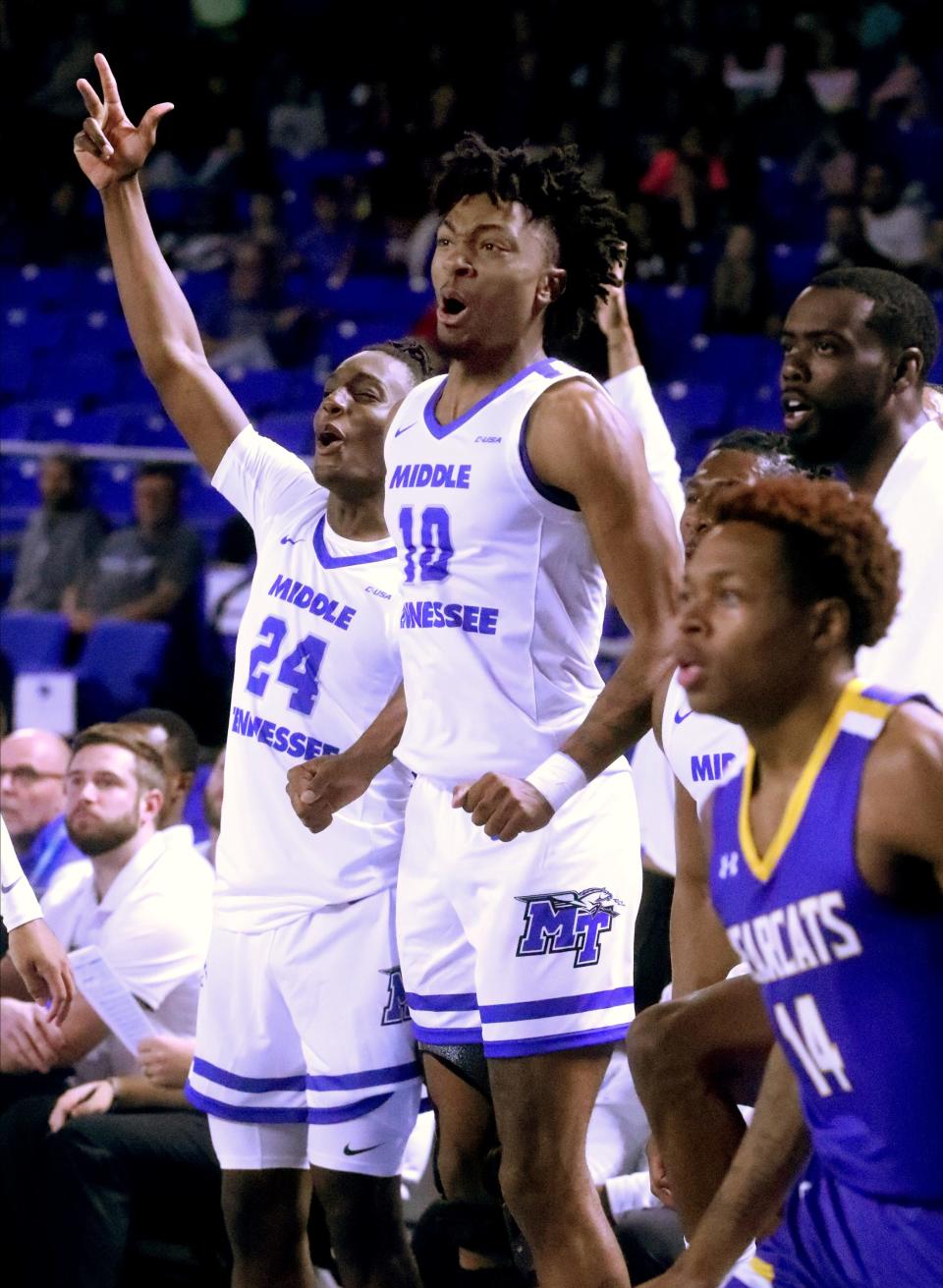 MTSU's Camryn Weston (24), Elias King (10) and Jared Coleman-Jones (31) celebrate a basket during a 2022 game.