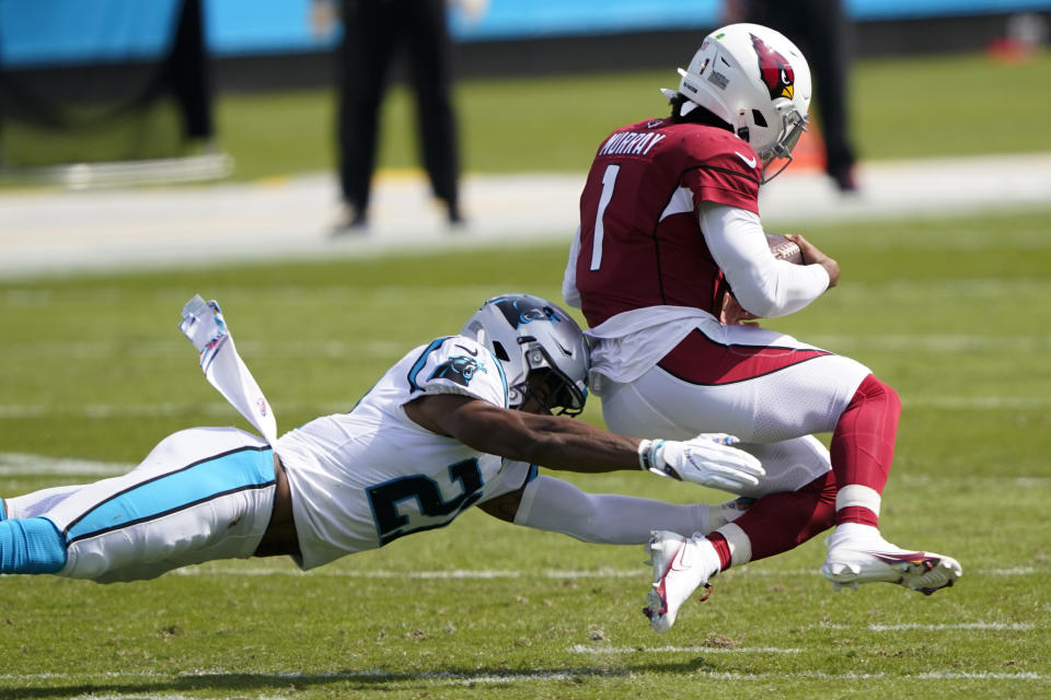 Arizona Cardinals quarterback Kyler Murray is tackled by Carolina Panthers outside linebacker Jeremy Chinn during the first half of an NFL football game Sunday, Oct. 4, 2020, in Charlotte, N.C. (AP Photo/Brian Blanco)