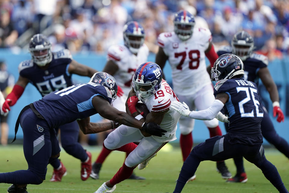 New York Giants wide receiver Kenny Golladay (19) makes a catch against the Tennessee Titans defense during the first half of an NFL football game Sunday, Sept. 11, 2022, in Nashville. (AP Photo/Mark Humphrey)