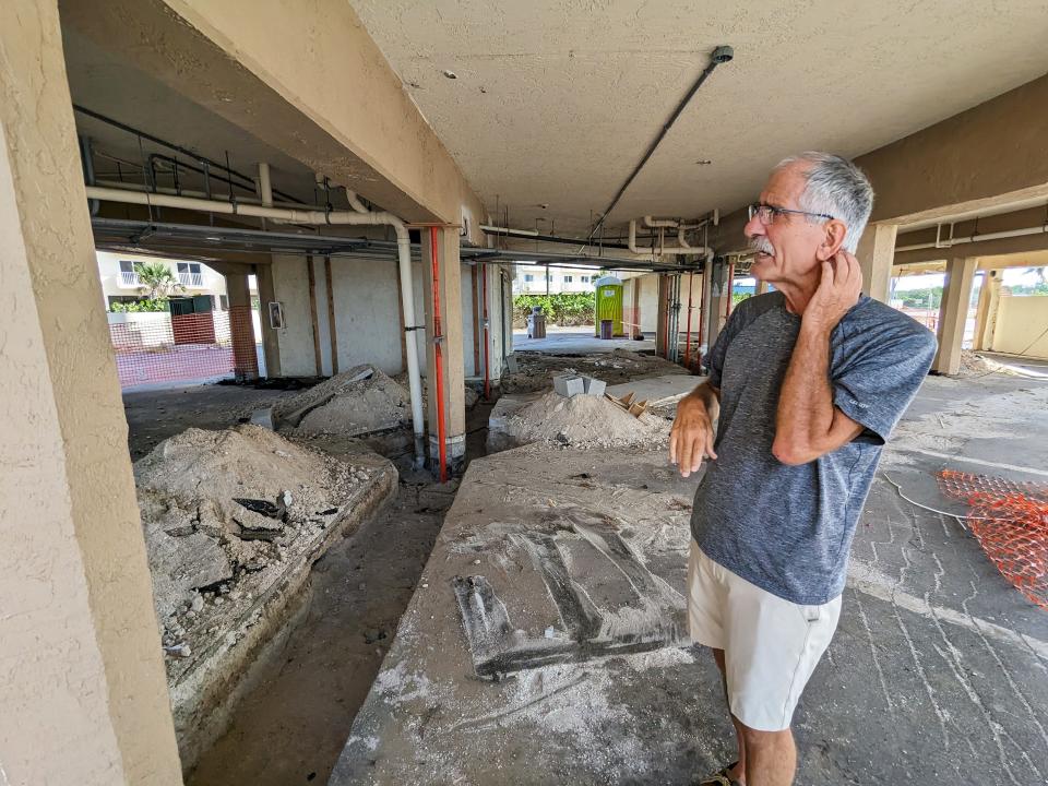 Ron George, President of the Seascape board, looks at the damage that still remains almost a year after Hurricane Ian..