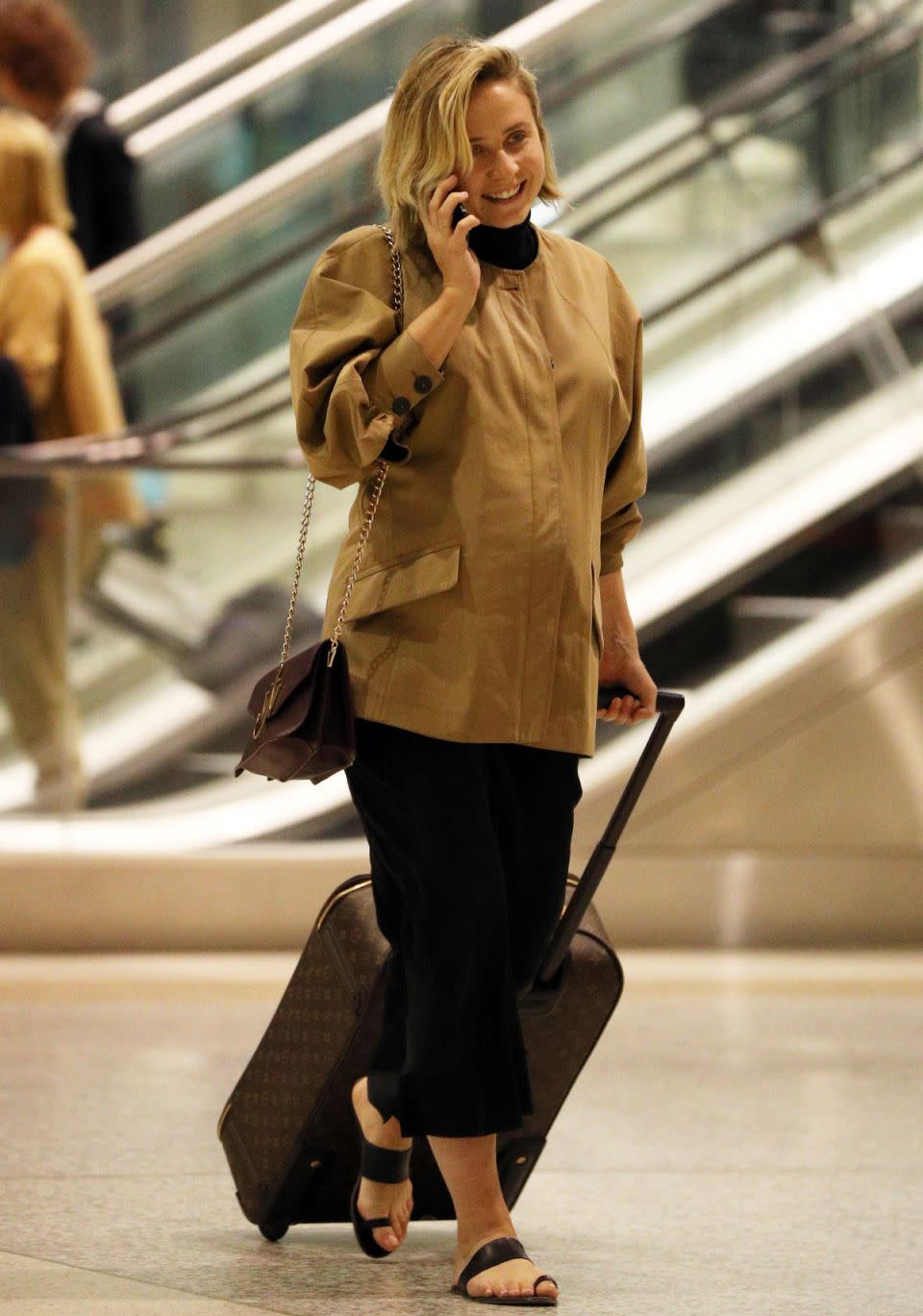 Tessa James flashed a smile as she touched down in Sydney yesterday. Source: MEGA