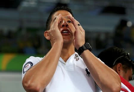 2016 Rio Olympics - Taekwondo - Preliminary - Men's -80kg Preliminary Round - Carioca Arena 3 - Rio de Janeiro, Brazil - 19/08/2016. Mark Lopez cheers on his brother Steven Lopez (USA) of USA (not pictured). REUTERS/Issei Kato