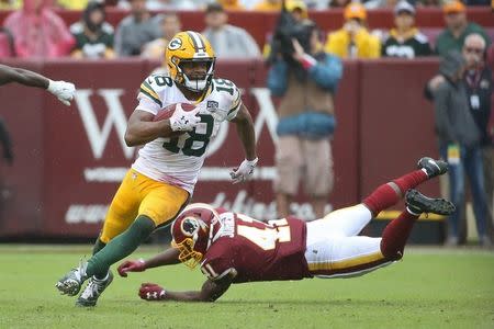 Sep 23, 2018; Landover, MD, USA; Green Bay Packers wide receiver Randall Cobb (18) runs with the ball past Washington Redskins defensive back Danny Johnson (41) in the third quarter at FedEx Field. The Redskins won 31-17. Mandatory Credit: Geoff Burke-USA TODAY Sports