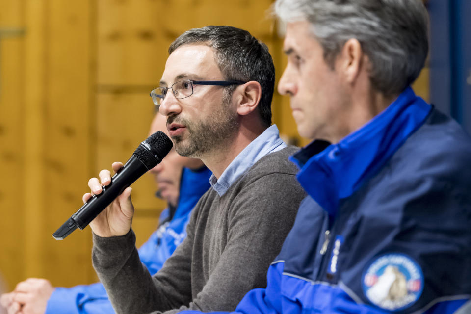 Frederic Favre, Valais state councillor, left, speaks as Christian Varone, head of Canton du Valais Police, right, listens during a press conference regarding an avalanche in the resort town of Crans-Montana, Switzerland, Tuesday, Feb. 19, 2019. Swiss mountain rescue teams pulled out several people who were buried in a mid-afternoon avalanche Tuesday at the popular ski resort of Crans-Montana and were searching for others, police said. (Anthony Anex/Keystone via AP)