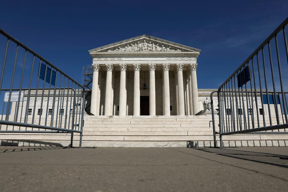 Temporary security fences align along a path to the plaza of the Supreme Court Building on April 19, 2023.