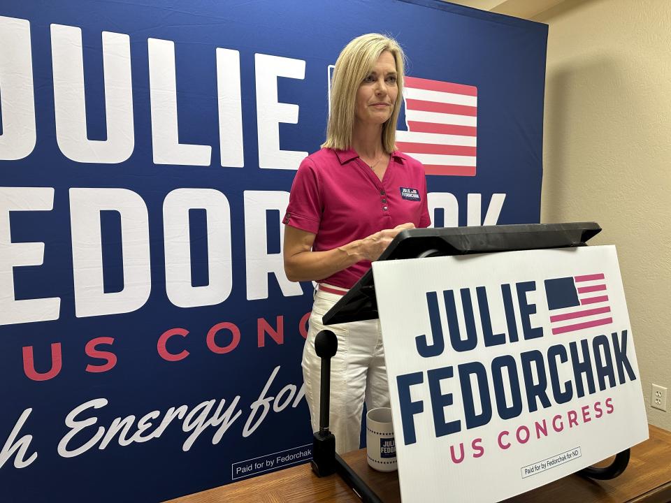 Public Service Commissioner Julie Fedorchak, a Republican candidate for North Dakota's single U.S. House seat, speaks to reporters during a press conference Tuesday, June 11, 2024, at her campaign office in Bismarck, N.D. Fedorchak condemned text messages that portray her as withdrawing from the competitive House race, the same day as the primary election. (AP Photo/Jack Dura)