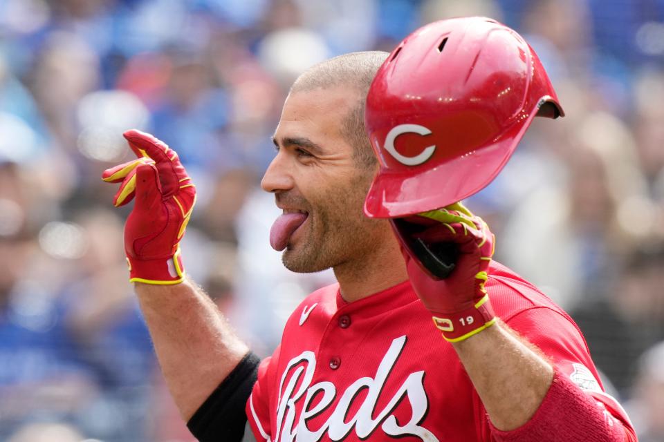 Cincinnati Reds' Joey Votto celebrates his solo home run against the Toronto Blue Jays during eighth-inning baseball game action in Toronto, Sunday, May 22, 2022. (Frank Gunn/The Canadian Press via AP)