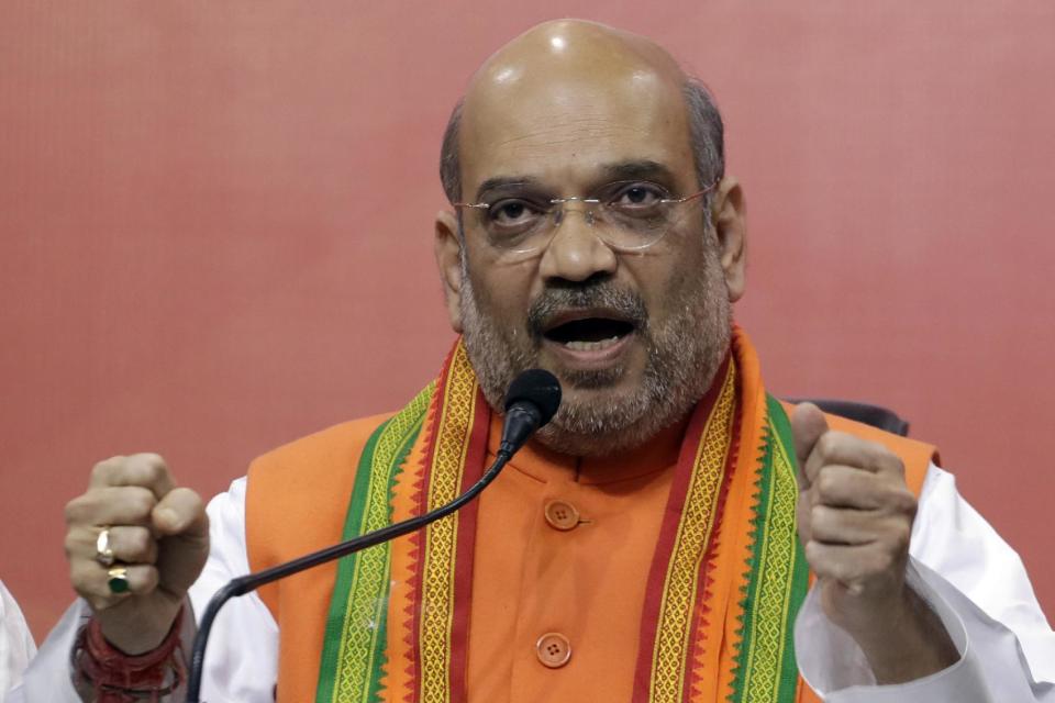 Bharatiya Janata Party President, Amit Shah gestures during a press conference at the party headquarters in New Delhi, India, Saturday, March 11, 2017. India's governing Hindu nationalist party was heading for major victories Saturday in key state legislature elections that are seen as a referendum on the performance of Prime Minister Narendra Modi's nearly 3-year-old government. (AP Photo/Tsering Topgyal)