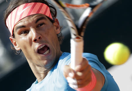 Rafael Nadal of Spain returns to Marsel Ilhan of Turkey during their second round match at the Rome Open tennis tournament in Rome, Italy May 13, 2015. REUTERS/Max Rossi
