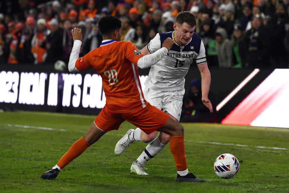 Notre Dame defender Paddy Burns battles for the ball during the second half of the NCAA college soccer tournament championship game in Louisville, Ky., Monday, Dec. 11, 2023. (AP Photo/Timothy D. Easley)