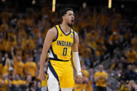 Indiana Pacers guard Tyrese Haliburton celebrates after making a three-point basket during the second half of Game 6 against the New York Knicks in an NBA basketball second-round playoff series, Friday, May 17, 2024, in Indianapolis. (AP Photo/Michael Conroy)