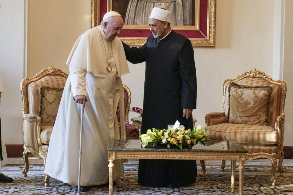 Pope Francis is greeted by Ahmed El-Tayeb, Grand Imam of al-Azhar, as he arrives for a meeting with the members of the Muslim Council of Elders at the Mosque of Sakhir Royal Palace, Bahrain, Friday, Nov. 4, 2022. Pope Francis is making the November 3-6 visit to participate in a government-sponsored conference on East-West dialogue and to minister to Bahrain's tiny Catholic community, part of his effort to pursue dialogue with the Muslim world. (AP Photo/Alessandra Tarantino)