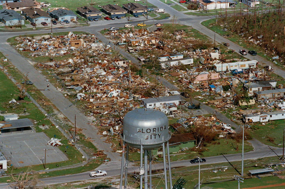 <p>This water tower, shown Aug. 25, 1992, a landmark at Florida City, Fla., still stands over the ruins of the Florida coastal community that was hit by the force of Hurricane Andrew. The storm damage to the South Florida area was estimated at $15 billion, leaving about 50,000 homeless. (AP Photo/Ray Fairall) </p>