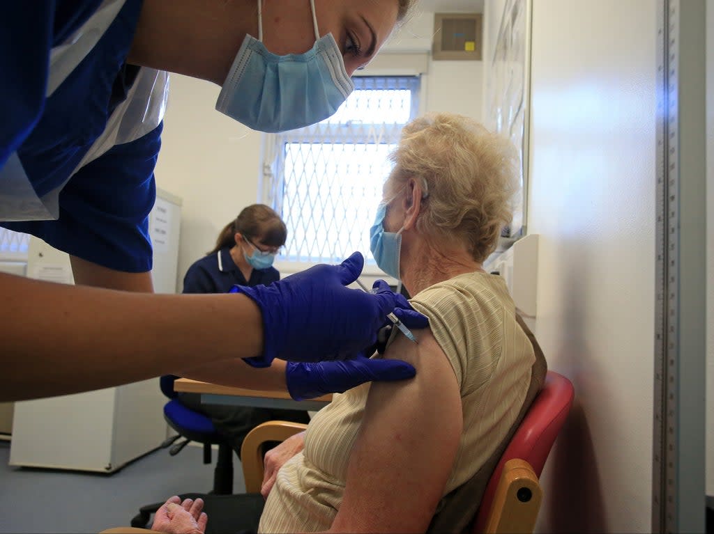 A nurse at a GP practice in Haxby vaccinates an elderly patient  (AFP/Getty)