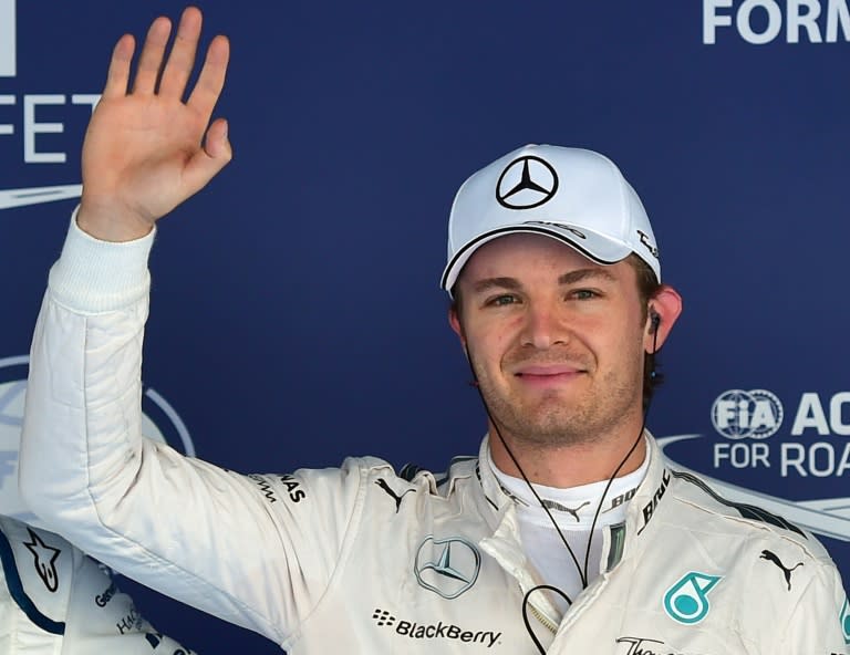 Pole position winner Nico Rosberg celebrates after the qualifying session of the Russian Grand Prix at the Sochi Autodrom circuit on October 10, 2015