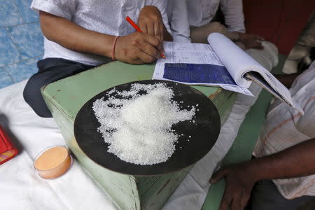 A sample of sugar crystals are seen on the desk of a trader at a wholesale market in Kolkata, India, April 26, 2016. REUTERS/Rupak De Chowdhuri