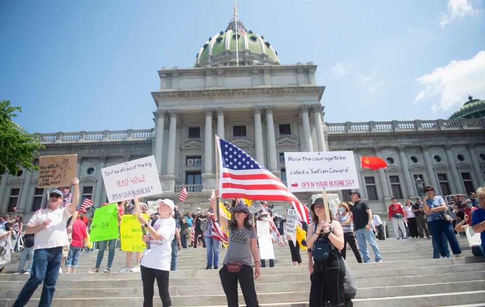 Thousands gather outside the Capitol building for a ReOpen PA rally in Harrisburg, Pa., on May 15.