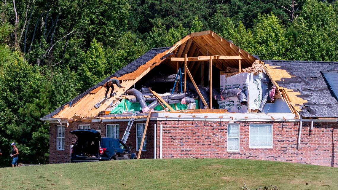 Works help clean up at a heavily damaged homes on Great Glen in the Belmont Lakes Country Club community in Rocky Mount Thursday, July 20, 2023. An EF3, tornado with wind speeds of 150 mph touched down in Nash County Wednesday around 12:30 p.m. Wednesday according to the Raleigh National Weather Service..