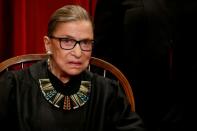 FILE PHOTO: U.S. Supreme Court Justice Ruth Bader Ginsburg participates in taking a new family photo with her fellow justices at the Supreme Court building in Washington