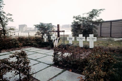 Crosses near the Berlin Wall, pictured in 1976, in tribute to East Berliners who died trying to escape to the West